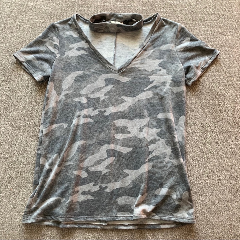 Camo v neck top with choker around the neck.